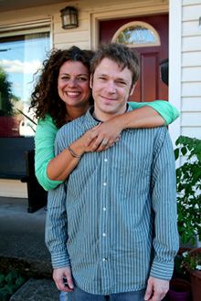 Photo of a family in front of a house